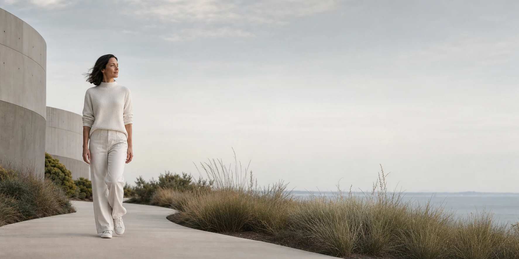 Adult walking along a quiet coastal path